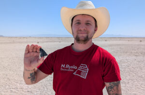 CEMML's Lucas Chapman holds the tip of a broken Haskett Projectile point at Hill Air Force Base.