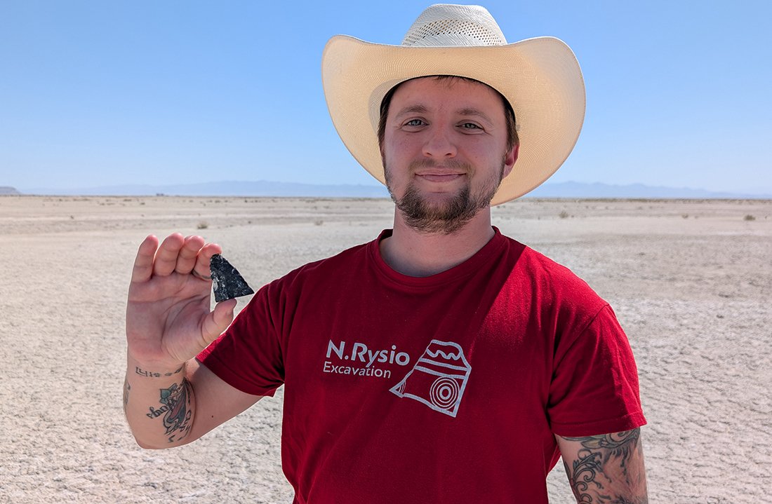 CEMML's Lucas Chapman holds the tip of a broken Haskett Projectile point at Hill Air Force Base.