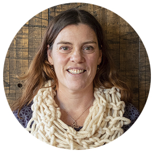 woman with a white knitted scarf around her neck